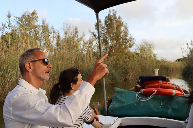 Albufera Private Day Tour: Paella, Boat Cruise and Nature Walk - Gola del Pujol walk: calm lake water, forest paths, and barracas