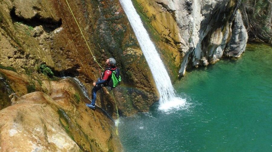 Bolulla: Estret de les Penyes Water Canyoning - Entering the Bolulla ravine: rocks, pools, and thermal spring energy