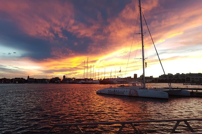 Sunset in Valencia from the Catamaran Mundo Marino - Boarding Mundo Marino, Cava Cup, and the La Marina Pass