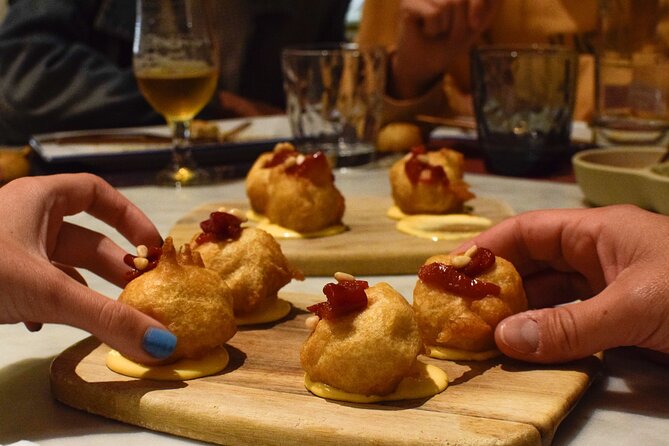 Valencia Centre Food Tour with 9+ Tastings of Regional Delicacies - Stop 3 on Carrer de la Puríssima, Mussels Tavern and a Regional Delicatessen